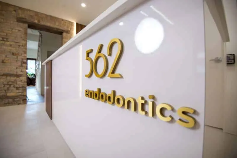562 endodontics gold logo sign on the reception wall