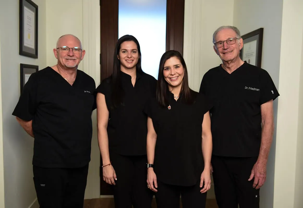The four endodontists of 562 endodontics in black scrubs